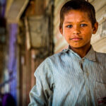 Life Is Not Easy. Boy Collects Waste Paper And Plastic Form Roads And Hoping For Good Future.