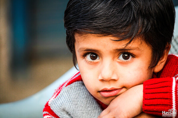 Innocent Child In Red Sweater On Road Side In Pir Mahal