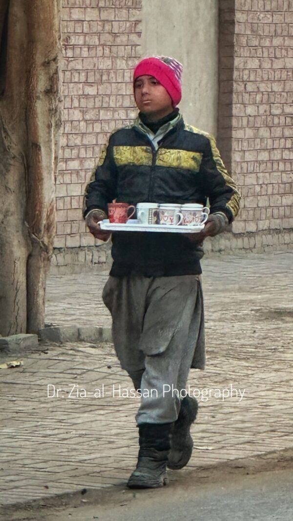 Poor Boy Working To Earn Money In Winter