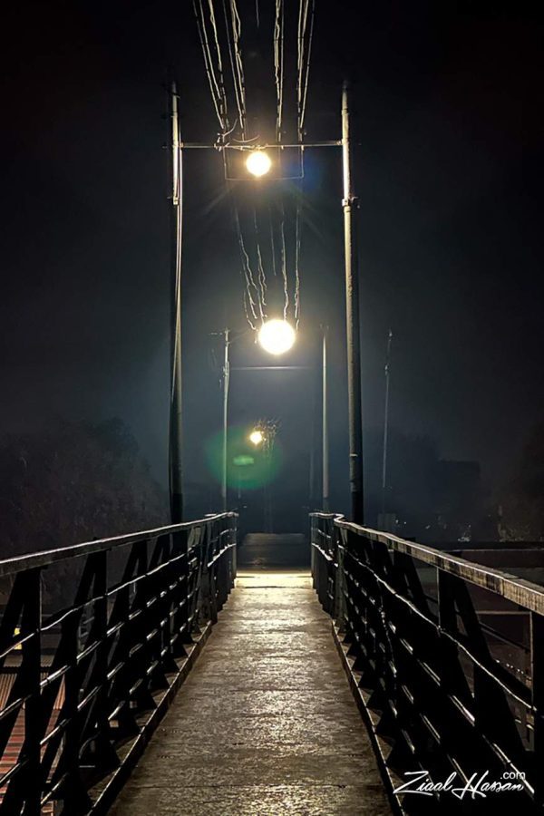 Atmospheric Pedestrian Bridge at Night with Industrial Lighting - Dr. Zia-al-Hassan Photography