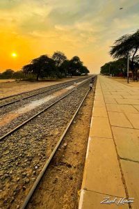 Golden Sunset Over Rural Railway Tracks at a Local Station - Dr. Zia-al-Hassan Photography